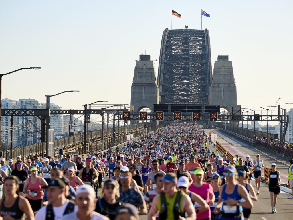 sydney marathon runners crossing the harbour bridge